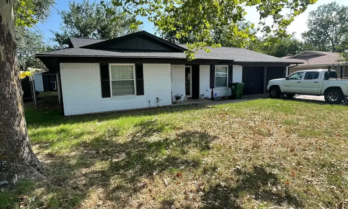 Professional roofing crew working on a residential roof in Jennings